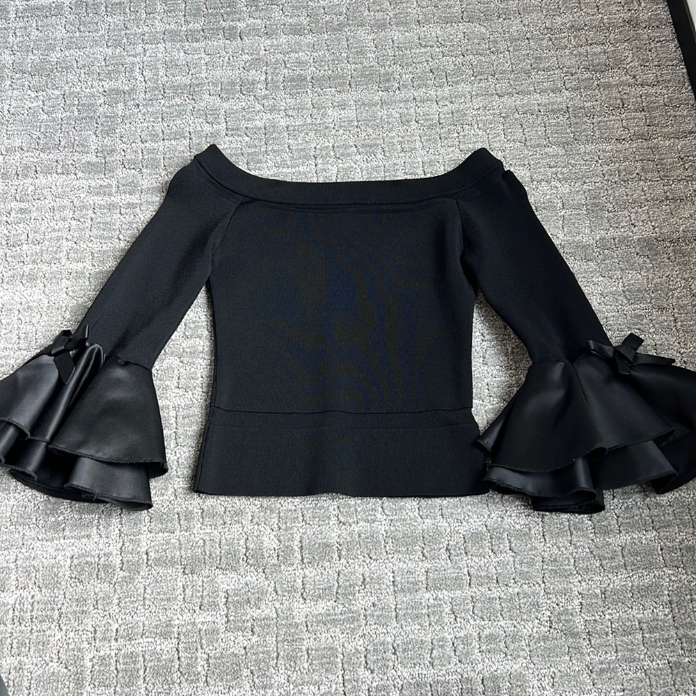 Strapless black top with silky bow bell sleeves